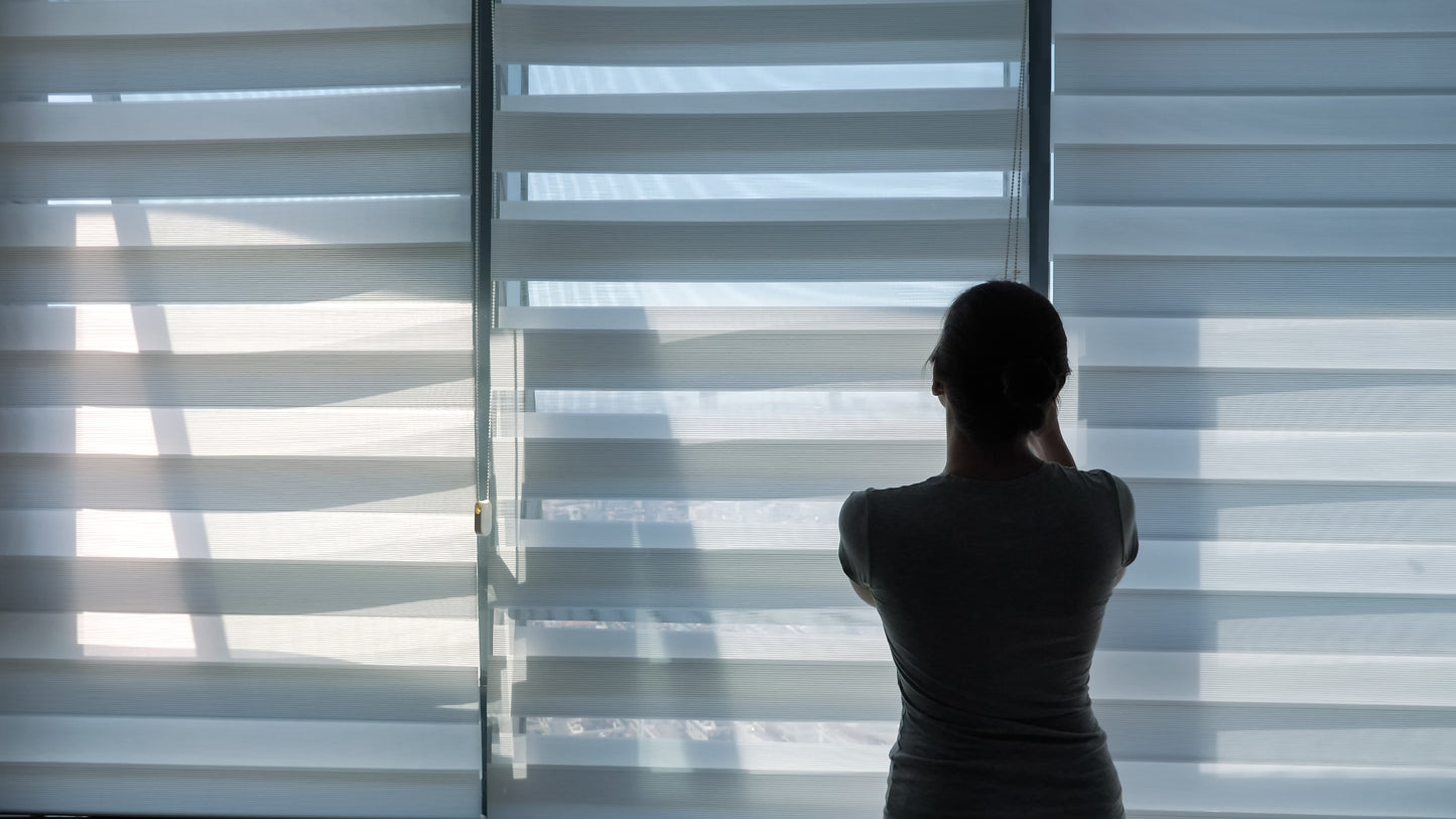 woman is opening blinds morning her modern apartment copy space